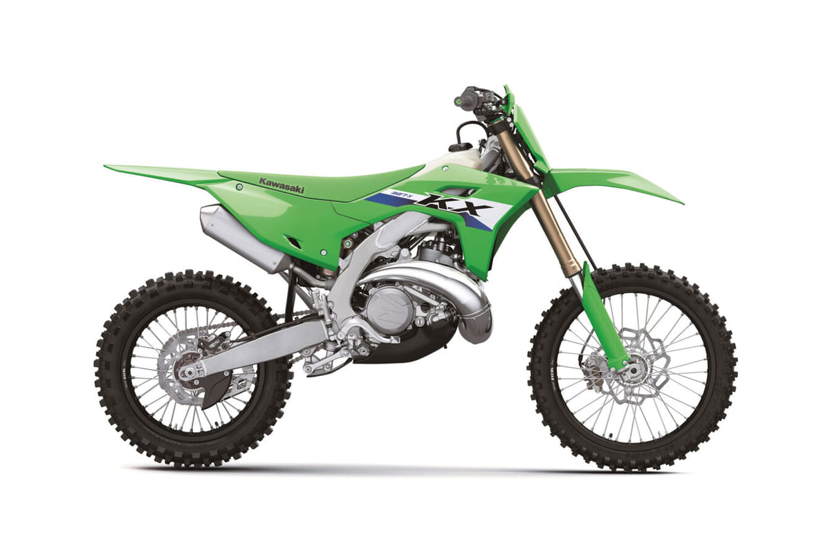 2027 Kawasaki KX327X cross-country two-stroke in lime green, right-side studio profile showing the exhaust pipe, gold forks and white radiator shrouds
