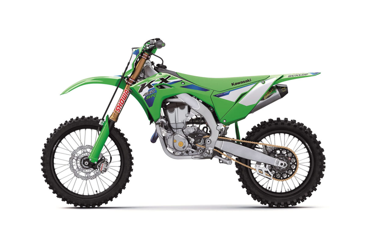 2026 Kawasaki KX450SR motocross bike in green with blue/white graphics, right-side studio profile showing gold Showa forks and titanium exhaust