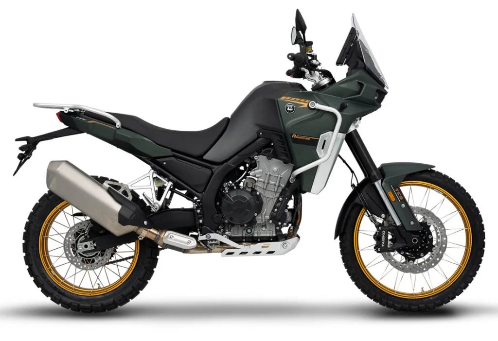 2026 Kove 800X Pro adventure motorcycle in matte green, left-side studio profile showing gold spoked wheels, twin exhaust and tall windscreen