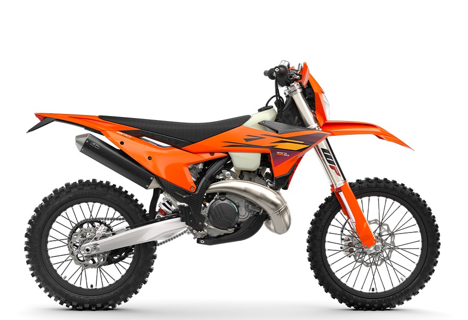 2027 KTM 300 XC-W dirt bike in orange with black seat, left-side studio profile showing the WP fork, high pipe exhaust and knobby tires
