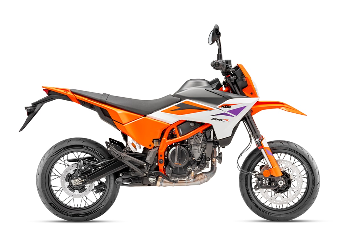2026 KTM 390 SMC R supermoto in orange, right-side studio profile showing the WP APEX fork, 17-inch wheels and slick supermoto tyres