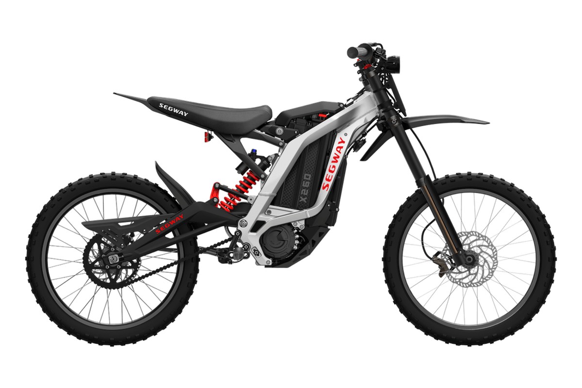 Segway X260 electric dirt bike in white and black, right-side studio profile on a white background