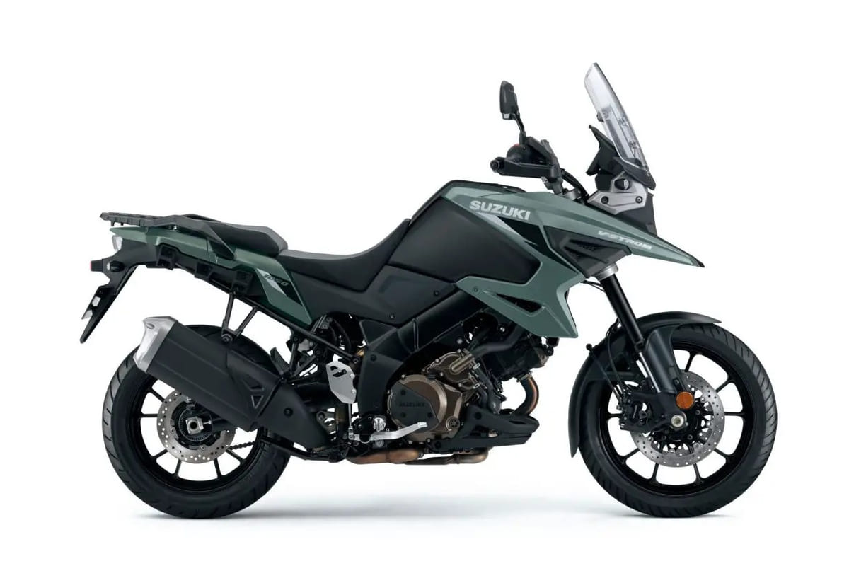 2026 Suzuki V-Strom 1050 adventure motorcycle in matte green and black, right-side studio profile showing the tall windscreen and V-twin engine