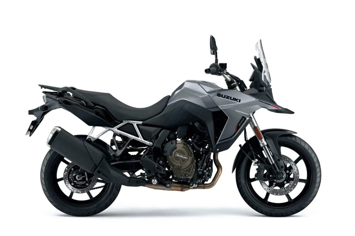 2026 Suzuki V-Strom 800 adventure motorcycle in gray, left-side studio profile showing the tall windscreen, spoked-look cast wheels and bronze exhaust headers