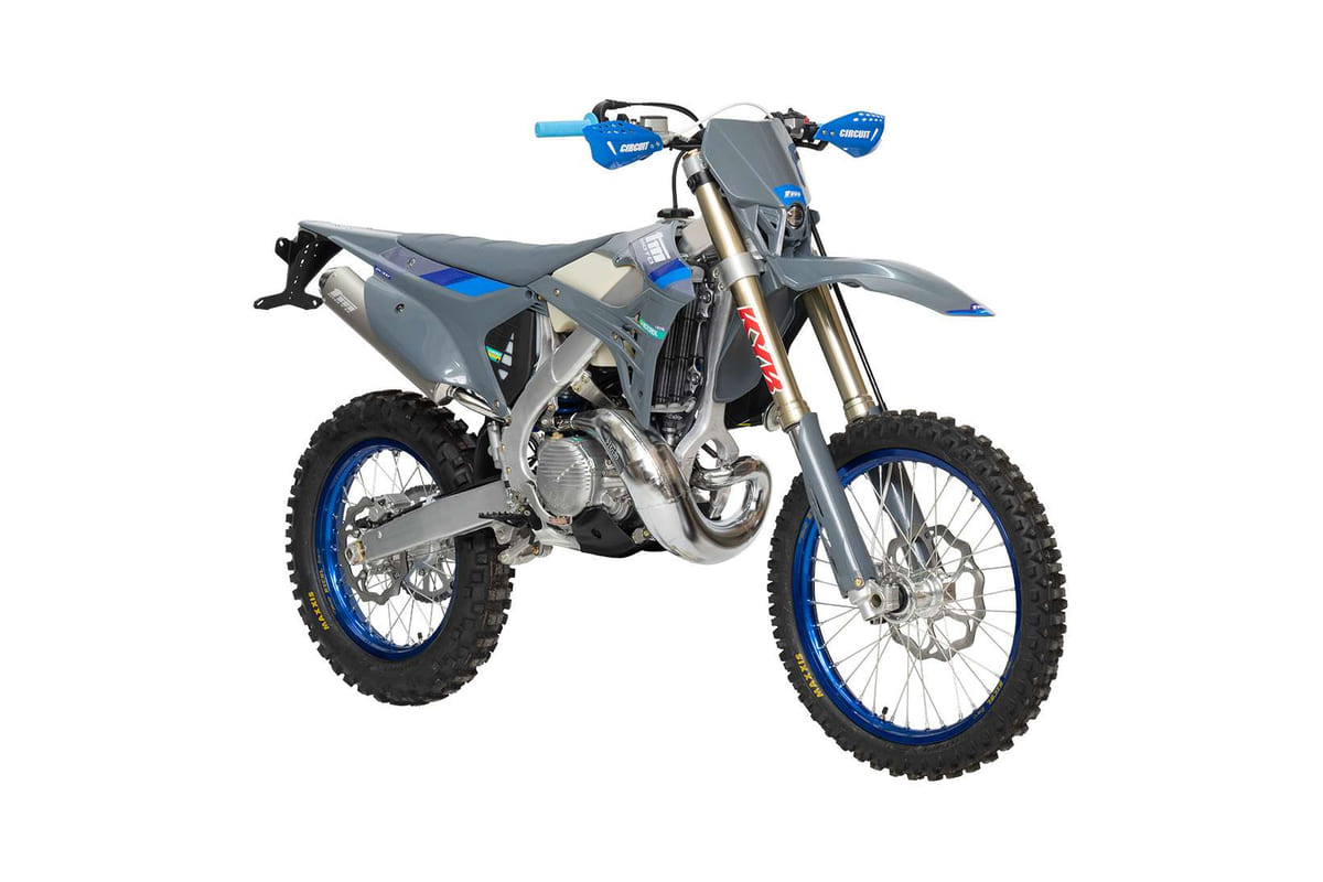 2026 TM EN 300 FI 2T enduro in grey with blue accents, front three-quarter studio profile showing gold KYB forks and blue rims