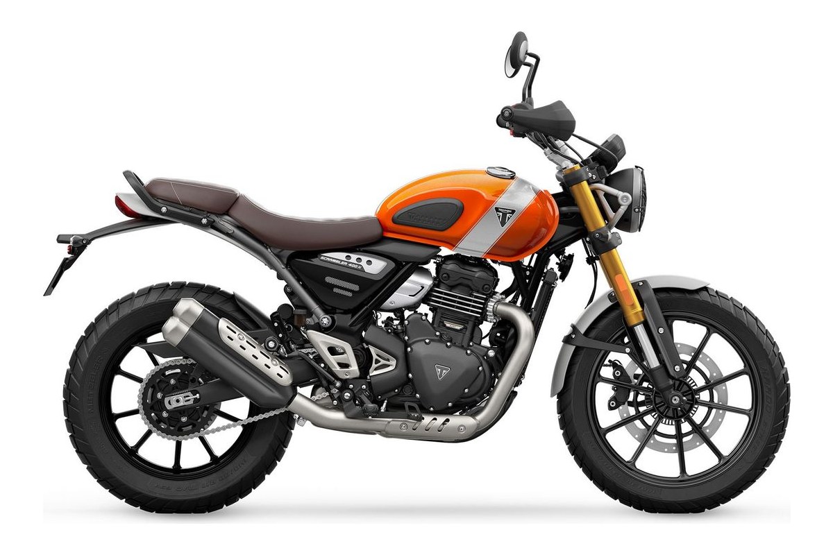 2027 Triumph Scrambler 400 X in green and white, left-side studio profile showing the brown twin-seat, gold USD forks and twin exhaust