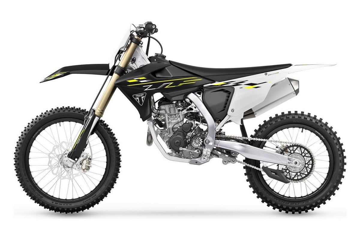 2026 Triumph TF 250-X motocross bike in black and white with yellow graphics, left-side studio profile showing gold-finish forks and white pipe-style exhaust