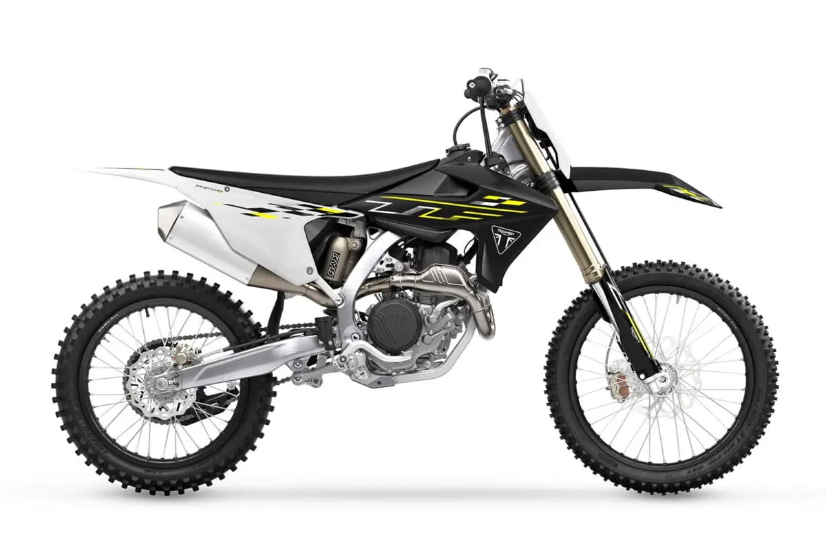 2026 Triumph TF 450-X motocross bike in black and white with yellow accents, right-side studio profile showing gold forks and titanium exhaust