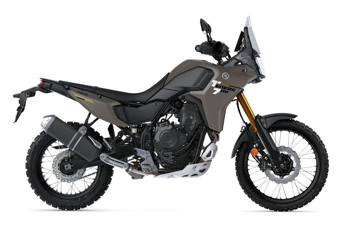 2026 Yamaha Ténéré 700 dual-sport in Team Yamaha Blue, left-side studio profile showing spoked wheels, upswept exhaust and rear rack mount